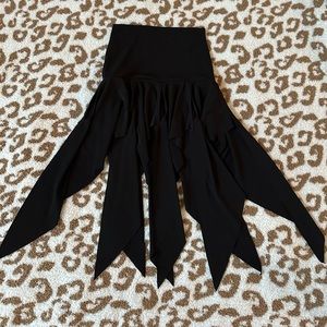 Black dance skirt featuring ruffled panels. Size S.